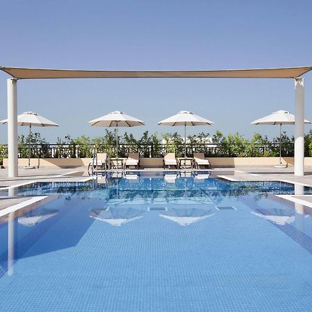 Moevenpick Hotel Apartments Al Mamzar Ντουμπάι Εξωτερικό φωτογραφία The swimming pool at the hotel