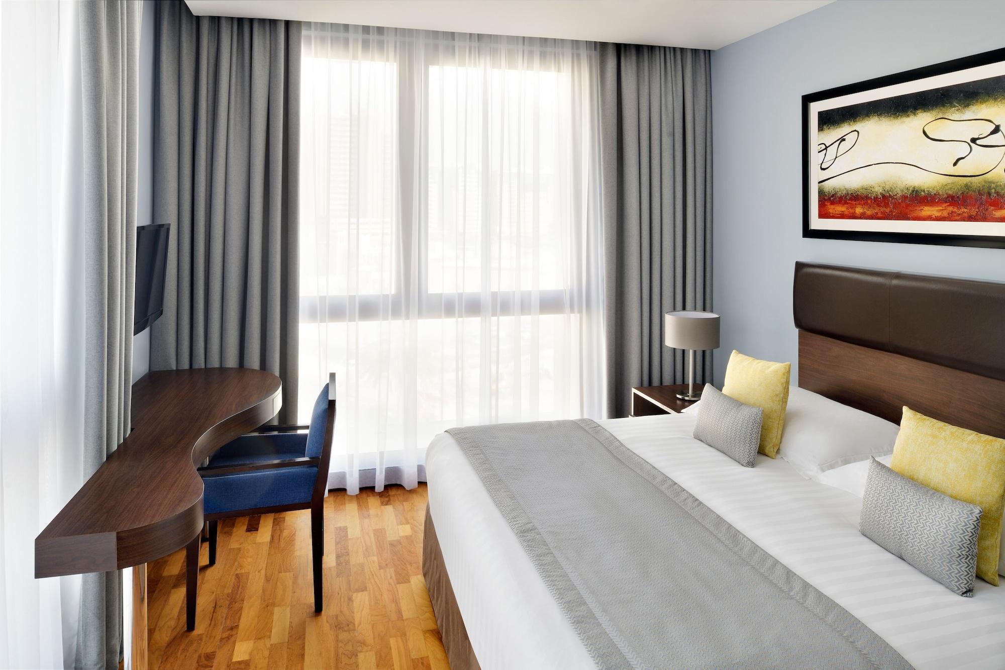 Moevenpick Hotel Apartments Al Mamzar Ντουμπάι Εξωτερικό φωτογραφία A typical room at the hotel