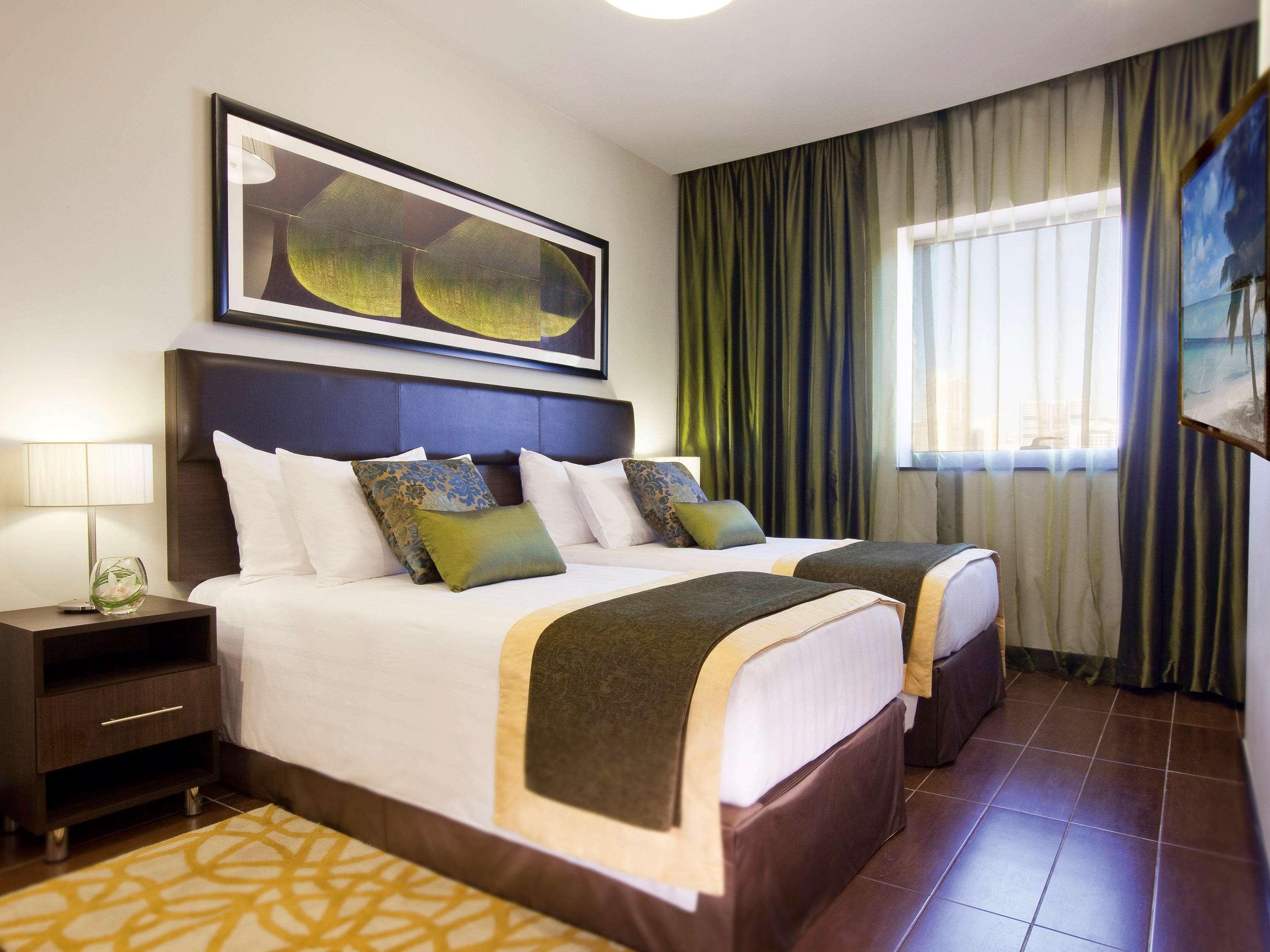 Moevenpick Hotel Apartments Al Mamzar Ντουμπάι Εξωτερικό φωτογραφία A bedroom at the hotel