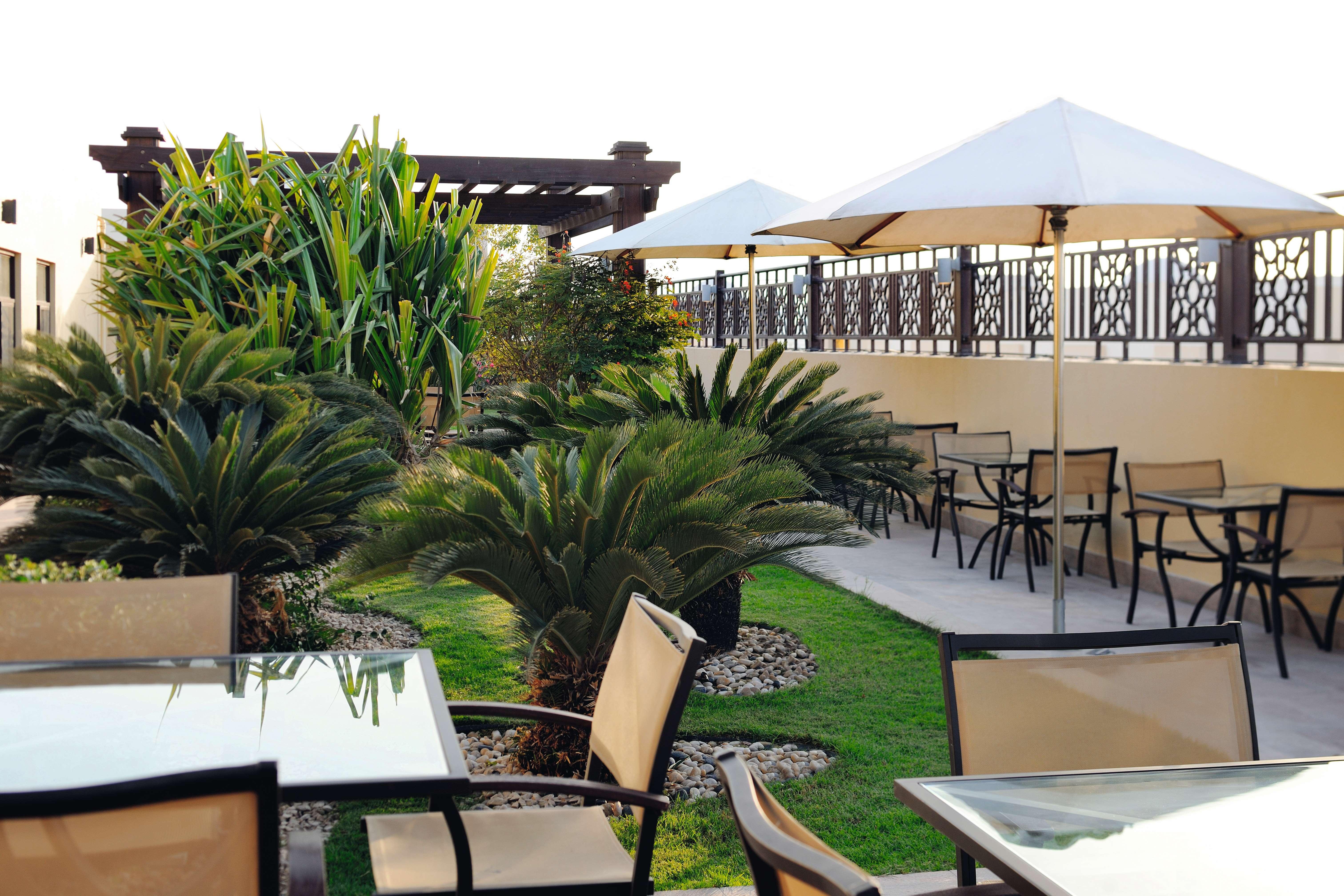 Moevenpick Hotel Apartments Al Mamzar Ντουμπάι Εξωτερικό φωτογραφία The rooftop garden at the hotel