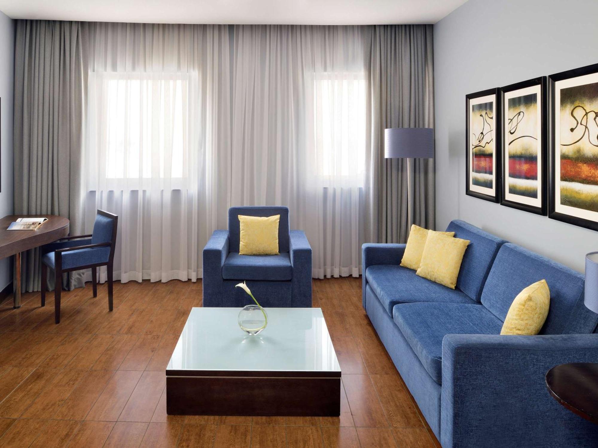 Moevenpick Hotel Apartments Al Mamzar Ντουμπάι Εξωτερικό φωτογραφία A living room