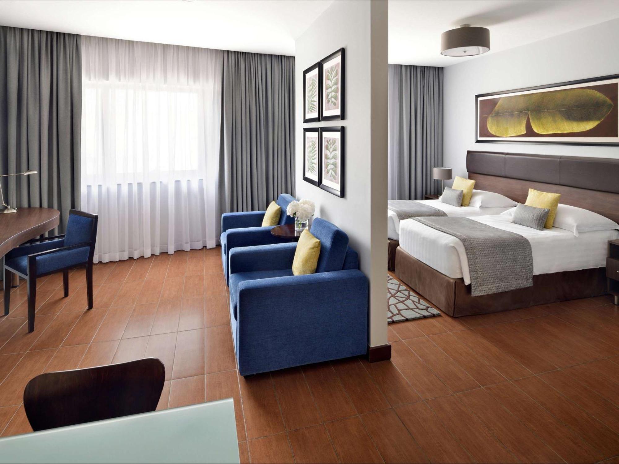 Moevenpick Hotel Apartments Al Mamzar Ντουμπάι Εξωτερικό φωτογραφία A room at the hotel