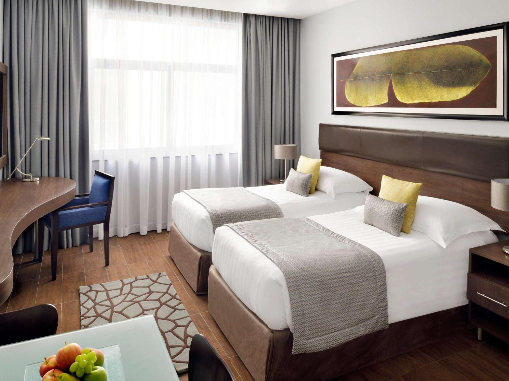 Moevenpick Hotel Apartments Al Mamzar Ντουμπάι Εξωτερικό φωτογραφία A room at the hotel