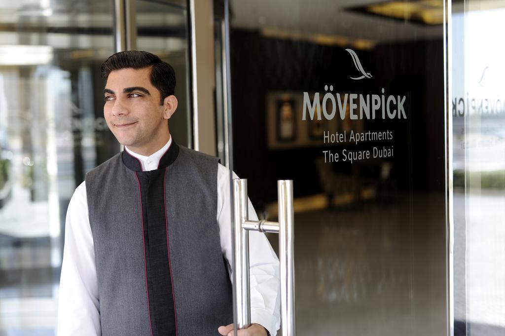 Moevenpick Hotel Apartments Al Mamzar Ντουμπάι Εξωτερικό φωτογραφία A doorman at a hotel in Dubai
